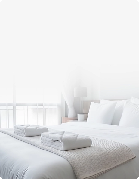 Hotel bed with fresh M&F linens